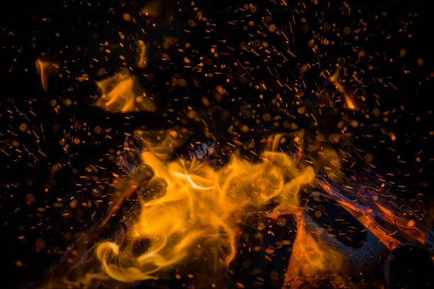 istock Yellow and Orange Fireball, heating up the black background. 1225872331