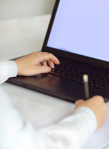 istock Female worker typing on the keyboard. Distance learning, education online. Online working from home, business and technology concept. Lockdown. 1225872649