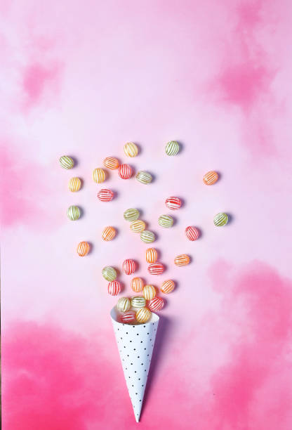 istock colorful candies on pink background 1225873347