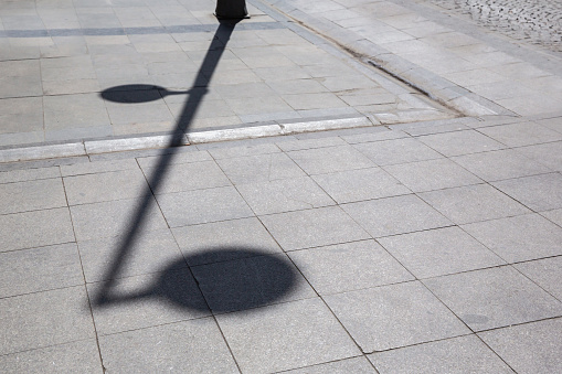 top view of street lamp and shadow