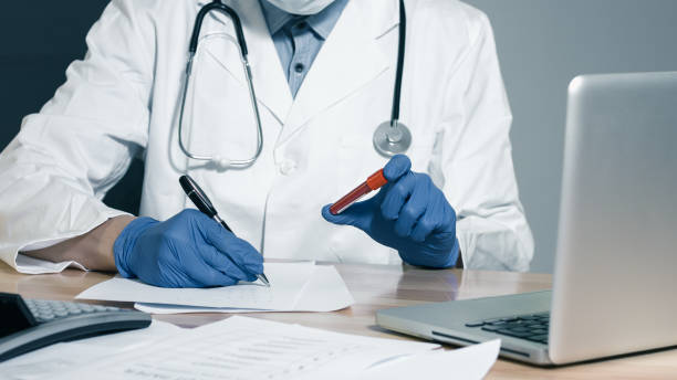 istock Hand of a doctor holding blood sample 1225874808