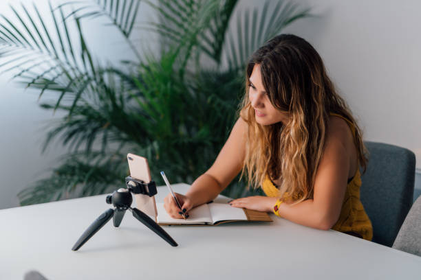 istock Woman making a video call with her smartphone at home 1225874848