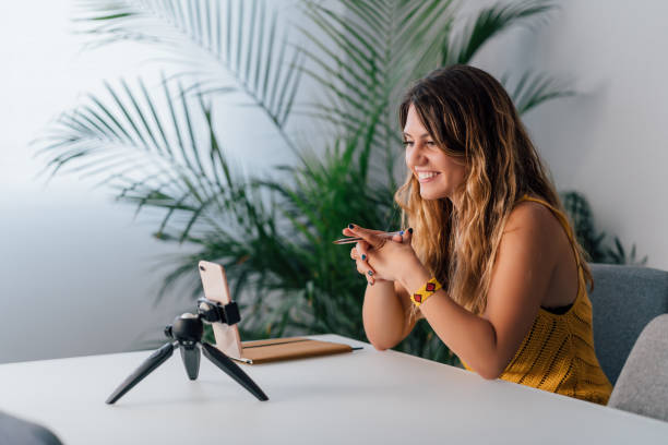 istock Woman making a video call with her smartphone at home 1225875498