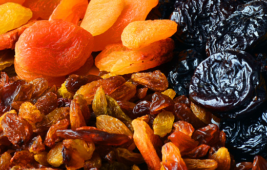 Dried fruits close-up, raisins, dried apricots, prunes, healthy nutrition