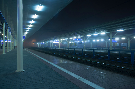 Poland - Lublin - The deserted railway platform with foggy blurred backgorund on the main train station