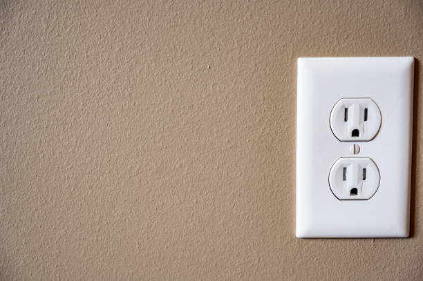 istock white dual electrical outlet with plate cover on beige colored drywall 1225875931