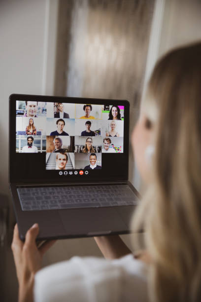 Video conference with business colleagues, young woman working from home Video conference with business colleagues, young woman working from home. lockdown business stock pictures, royalty-free photos & images