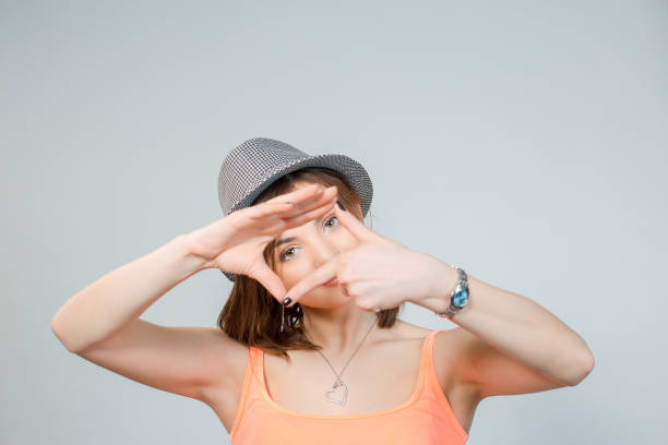 istock Happy woman making frame with fingers 1225880364