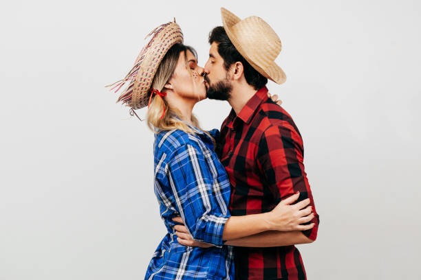 brazilian couple wearing traditional clothes for festa junina - june festival - santa hat fotos - fotografias e filmes do acervo