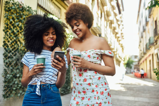 istock Best friends drinking coffee and surfing the net together 1225884231