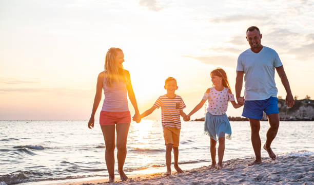 istock Family walks on the beach 1225884489