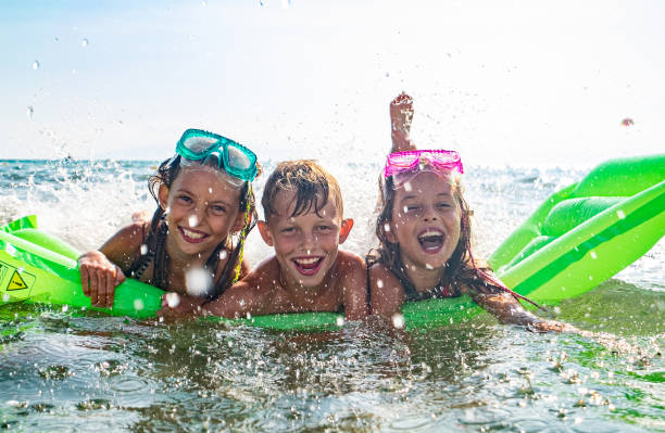 istock Three kids on inflatable mattress 1225885096