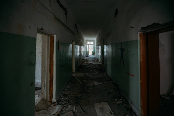 istock Dark creepy corridor of abandoned building 1225886993