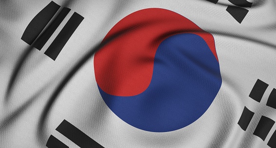 Flag of South Korea waving in the wind giving an undulating texture of folds in the fabric. The Image is in the official ratio of the flag - 2:3.