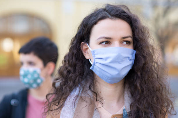 istock People wearing masks during COVID-19 outbreak 1225891390