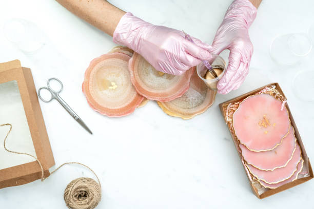 istock Creativity and craft. A young girl creates coasters from resin. Gift wrapping. Decorative packaging. Idea for business. Remote work, work at home. Art coasters. 1225892471