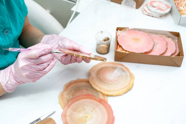 istock Creativity and craft. A young girl creates coasters from resin. Gift wrapping. Decorative packaging. Idea for business. Remote work, work at home. Art coasters. 1225892472