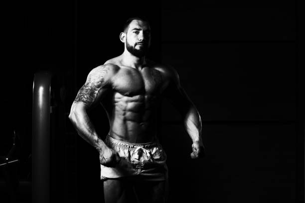 istock Healthy Young Man Flexing Muscles 1225892581