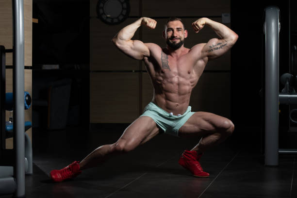 istock Muscular Men Is Hitting Rear Double Bicep Pose 1225892596