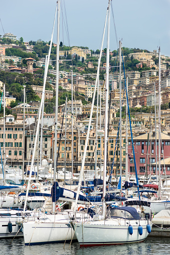 Genoa, Italy - May 19, 2017: Pleasure boats in Marina Porto Antico in Genoa, Italy. This photograph was taken midday with full frame camera and Zeiss telephoto lens.
