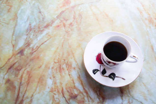 istock Black coffee in a coffee cup for breakfast, placed on a marble table 1225893881