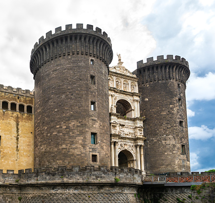 Naples, Italy - October 11, 2016: Castel Nuovo / New Castle is a medieval castle located in central Naples, Campania, Italy. This photograph was taken midday with full frame camera and Zeiss wide-angle lens.