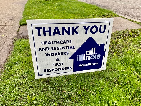Yard sign thanks healthcare and essential workers during COVID-19 pandemic, as part of Illinois' All In Illinois campaign.