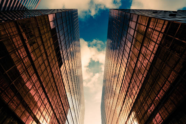 istock Looking up at golden skyscrapers 1225905486