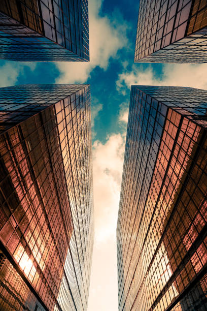 istock Looking up at golden skyscrapers 1225905494