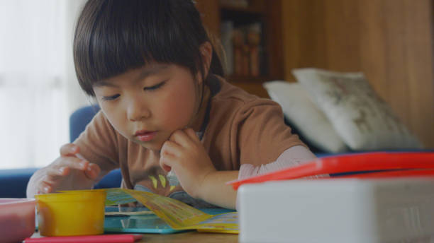 istock Young girl enjoy playing with clay at home. 1225908968