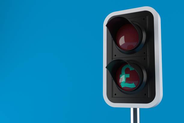 istock Green traffic light with pound currency symbol 1225914556