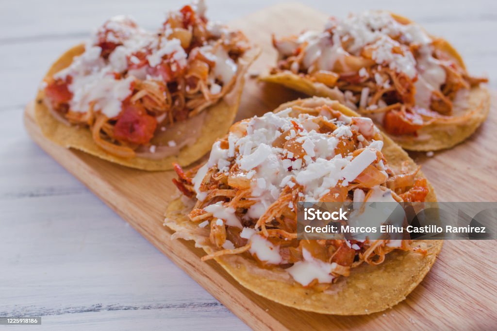 Mexican toast with chicken, mexican food chicken tinga in mexico Tostadas Mexicanas with chicken, tinga de pollo mexican food in mexico Tostada Stock Photo