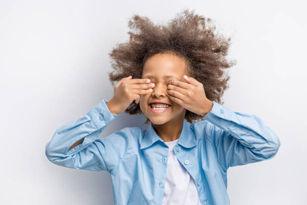 istock smiling child closed eyes 1225918422