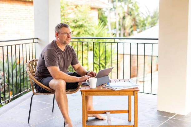 istock Mature Man Working From Home on a Balcony Patio 1225919095