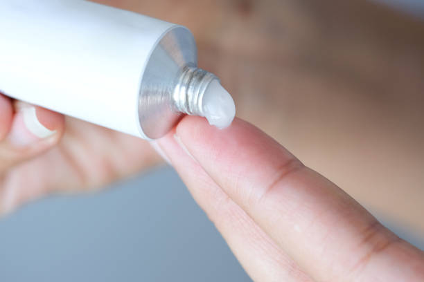 istock The woman's hand, she uses steroids Apply External type 1225919136