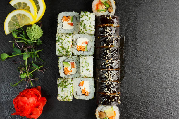 istock Japanese food: Set of salmon sushi and rolls with salmon and eel 1225920339
