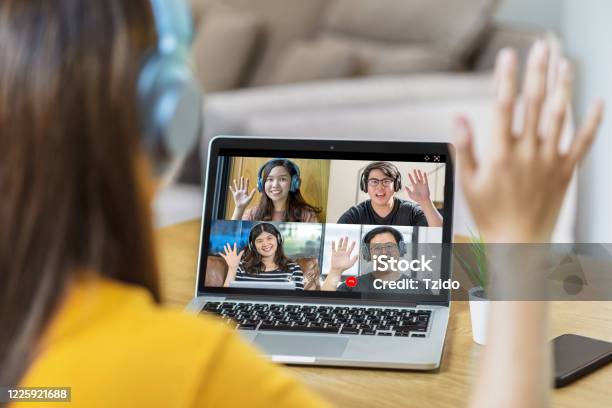 Rear View Of Asian Business Woman Say Hello With Teamwork Colleague In Video Conference Stock Photo - Download Image Now