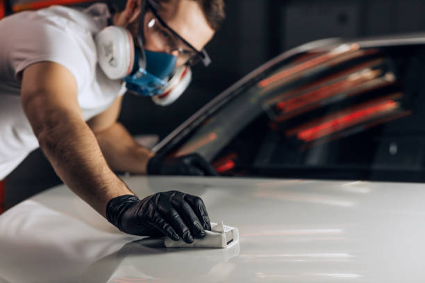 istock young man clears polish a vehicle 1225921696