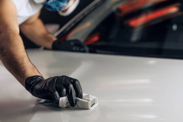 istock young mechanic in mask working carefully at the garage 1225922407