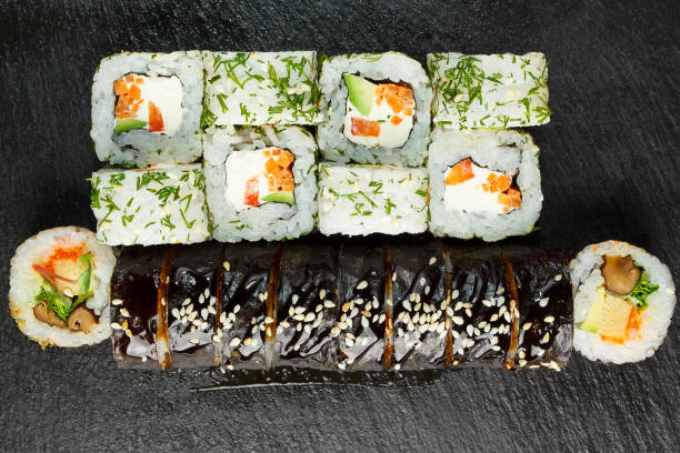 istock Japanese food: Set of salmon sushi and rolls with salmon and eel 1225922700