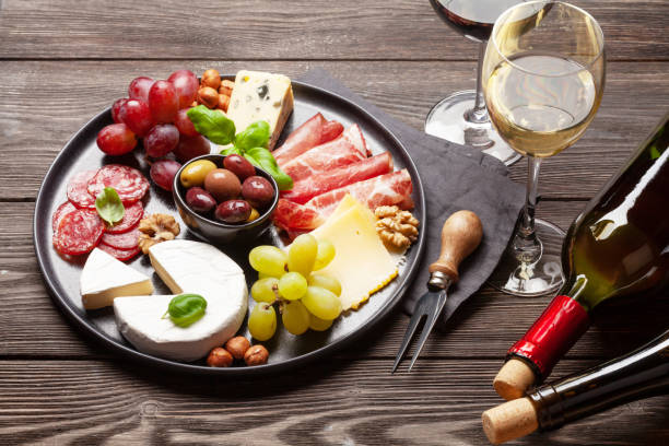 istock Cheese, meat, grapes and olives antipasto 1225923840