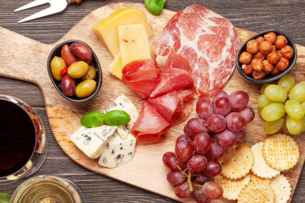 istock Cheese, meat, grapes and olives antipasto 1225923854