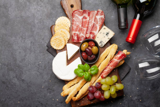 istock Cheese, meat, grapes and olives antipasto 1225923893