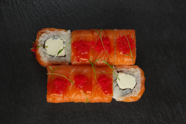 istock Japanese food: Set of salmon sushi and rolls with salmon and eel 1225923955