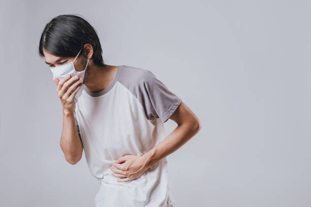 istock man wearing a medical mask have a sick. 1225925300