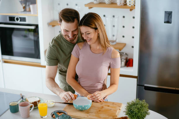 istock Young couple making breakfast at home. 1225927498