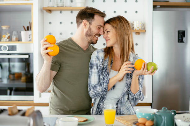 istock Young couple making breakfast at home. 1225927515