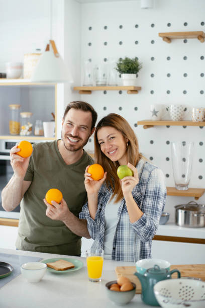 istock Young couple making breakfast at home. 1225927516