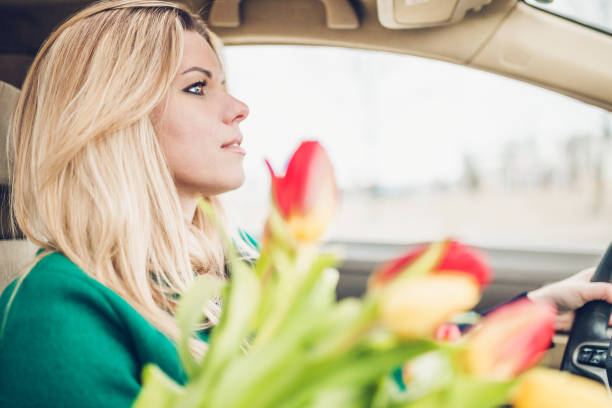 istock Finnish blonde in a car driving 1225927597