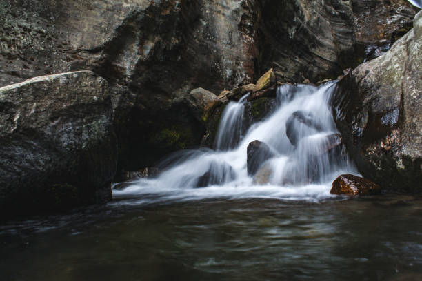 istock Beautiful waterfall of silky water going down the mountain 1225928084